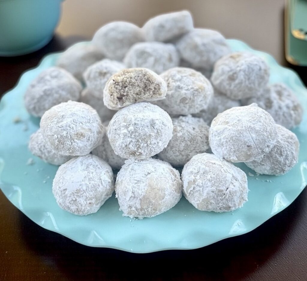 snowball cookies on a blue plate
