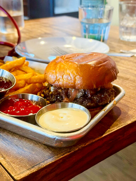 Classic Burger at CRAFT Lettuce, Tomato, Cheddar Cheese, Aioli, Ketchup on Brioche Bun