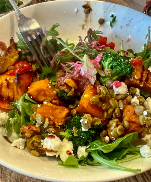 Roasted Pumpkin salad with Broccoli, Curried Lentils, Goat Cheese, Cherry Tomato, Caramelized Onions, Green Leaves, Beetroot Aioli & Pralines